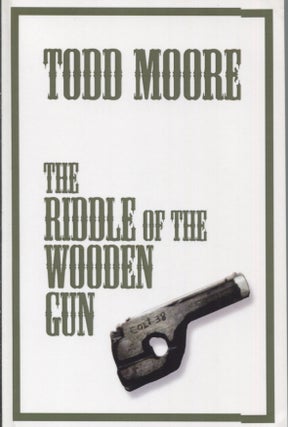 Item #21433 THE RIDDLE OF THE WOODEN GUN. Todd Moore